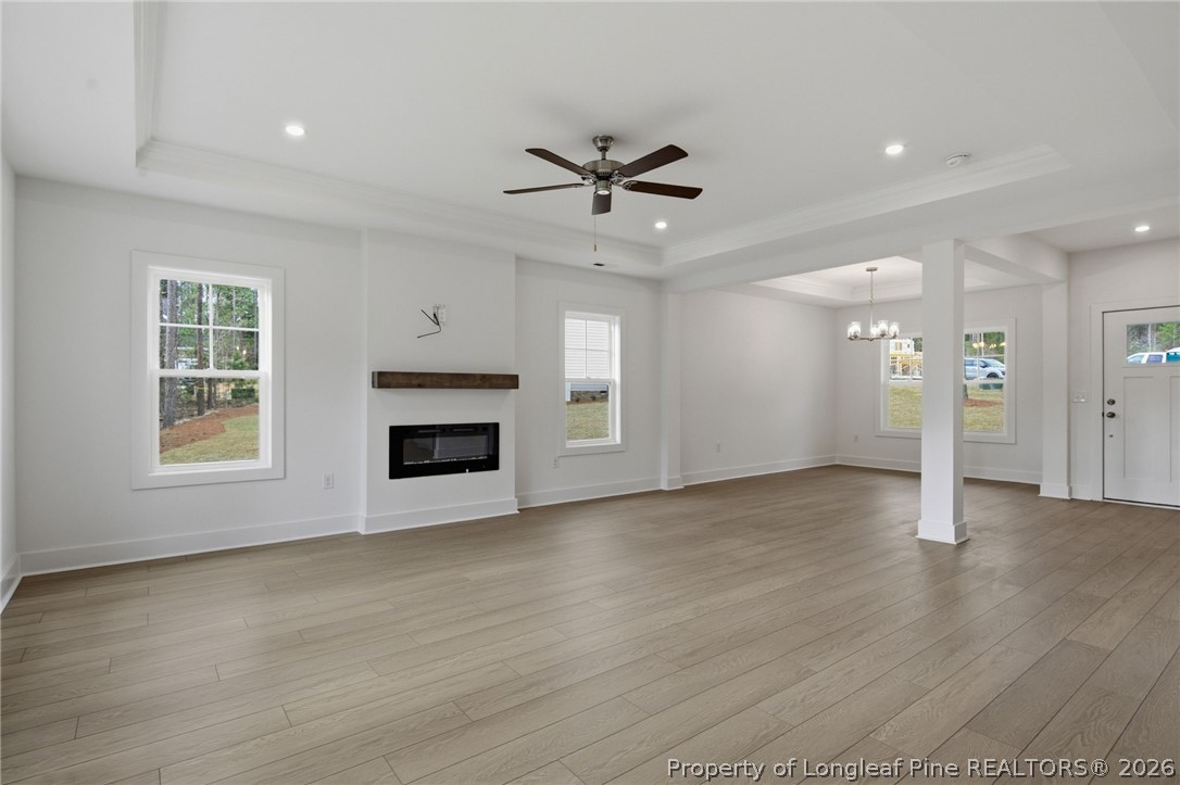 96 Graduate Ct Spring Lake Spring Lake, NC 28390 - Photo 3 of 49 a view of an empty room with a fireplace and a window
