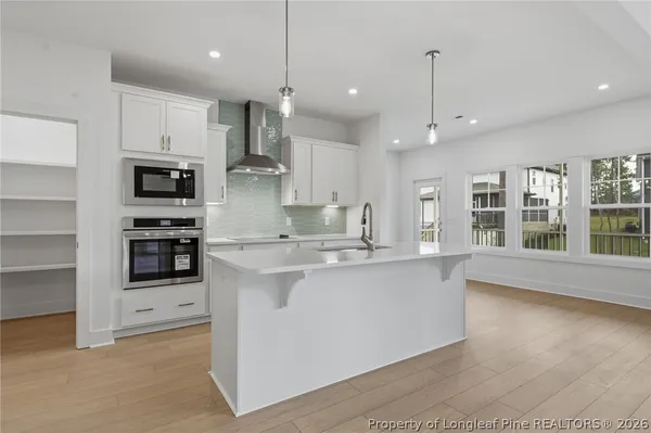 a bathroom with a double vanity sink and mirror