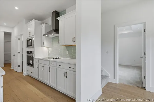a bathroom with double sink and a mirror