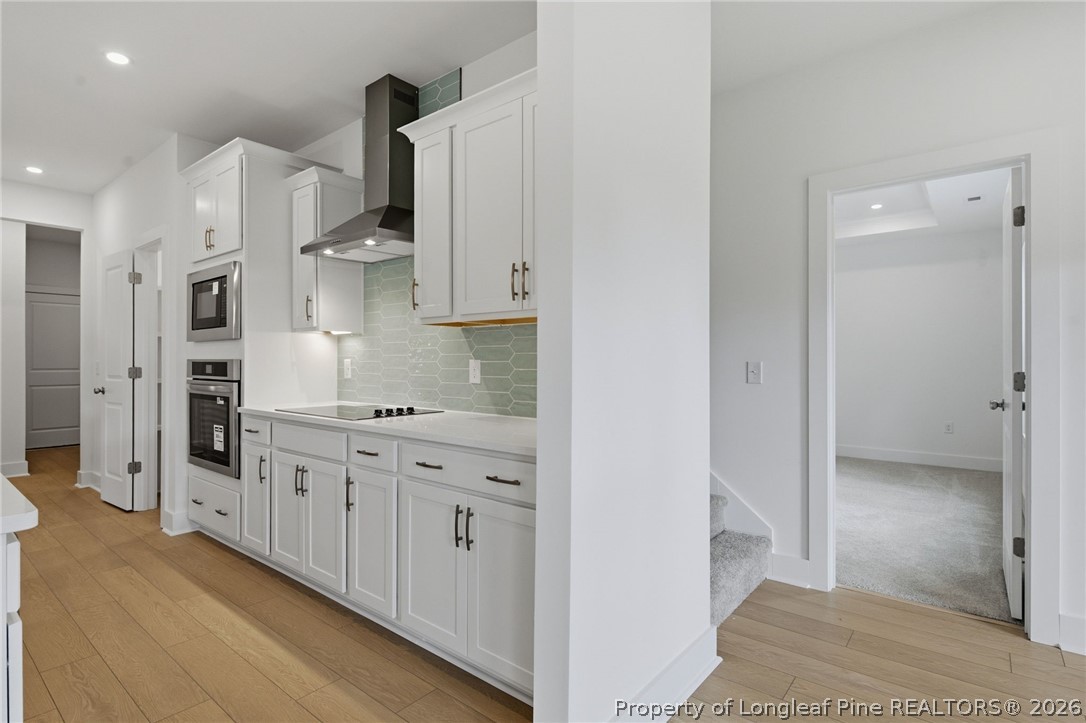 96 Graduate Ct Spring Lake Spring Lake, NC 28390 - Photo 7 of 49 a kitchen with stainless steel appliances granite countertop a refrigerator and a sink