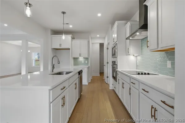a bathroom with a double vanity sink mirror and shower