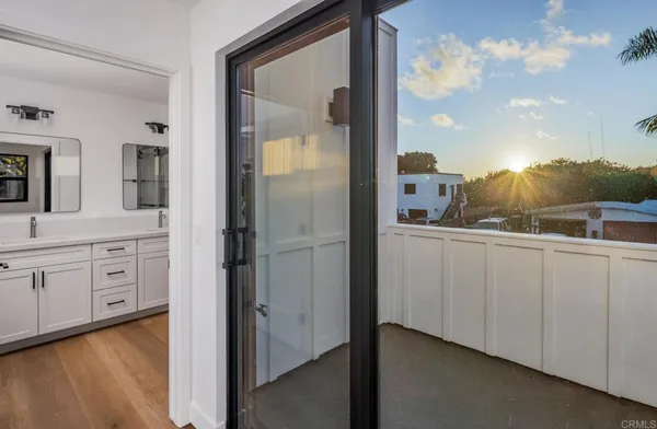 a kitchen with granite countertop a refrigerator stove top oven and sink