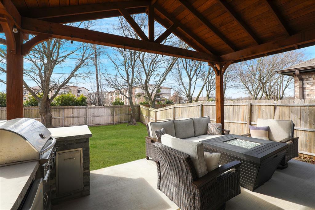 813 Williams Way Van Alstyne, TX 75495 - Photo 23 of 27 a backyard of a house with table and chairs