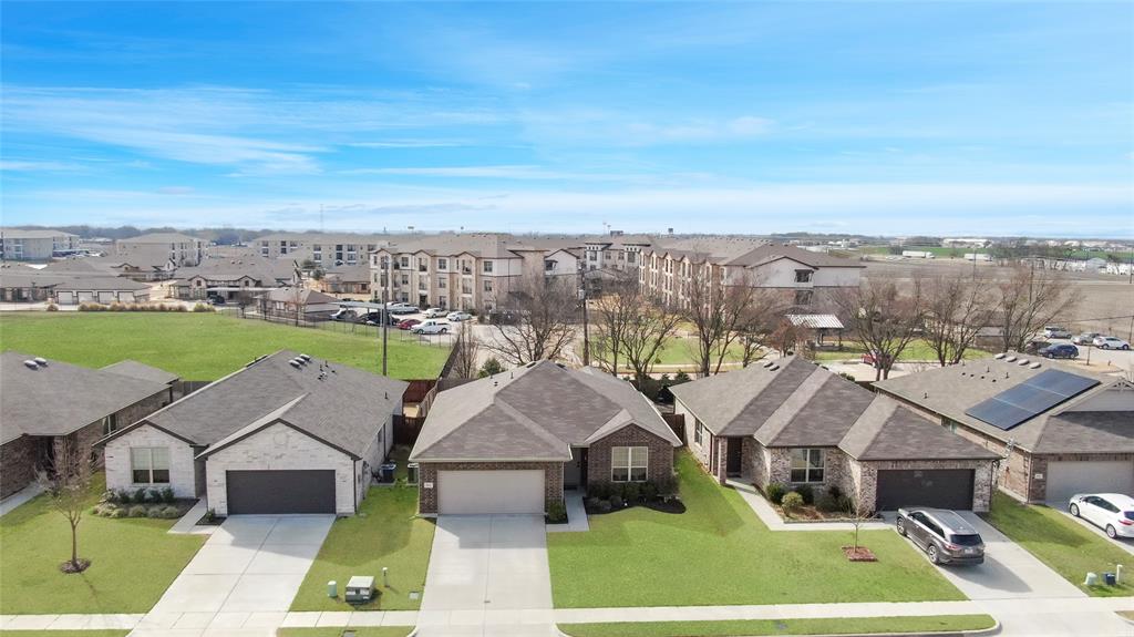813 Williams Way Van Alstyne, TX 75495 - Photo 25 of 27 an aerial view of houses with a yard
