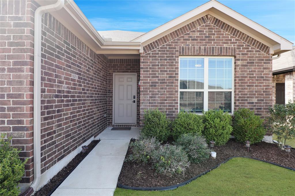 813 Williams Way Van Alstyne, TX 75495 - Photo 6 of 27 a front view of a house with garden