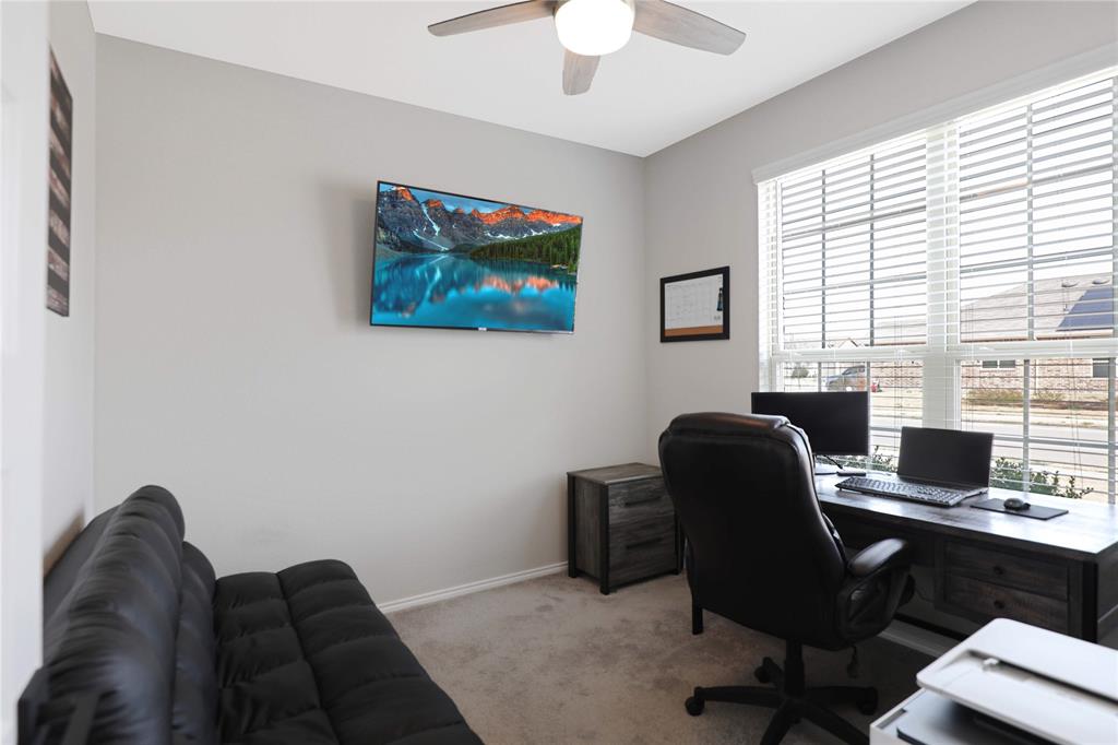 813 Williams Way Van Alstyne, TX 75495 - Photo 9 of 27 a view of a workspace with furniture and a window