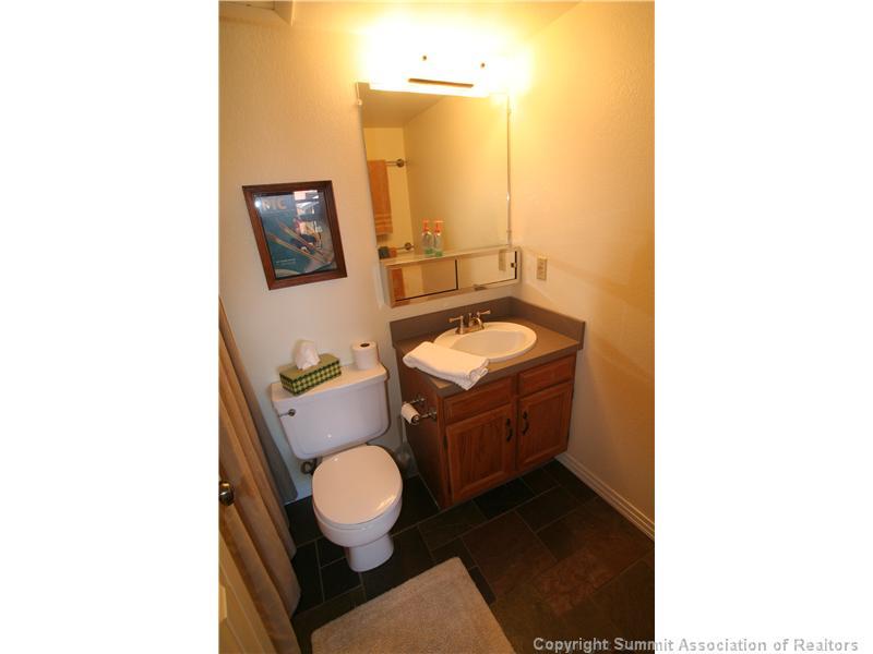 520 Bills Ranch Road, Unit 343 Frisco, CO 80443 - Photo 3 of 21 a bathroom with a toilet mirror and vanity