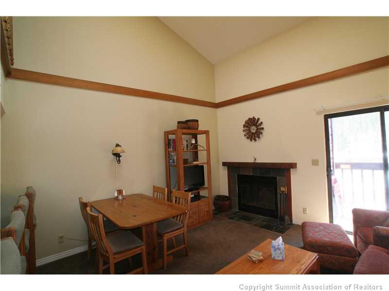 520 Bills Ranch Road, Unit 343 Frisco, CO 80443 - Photo 8 of 21 a room with furniture and a fireplace