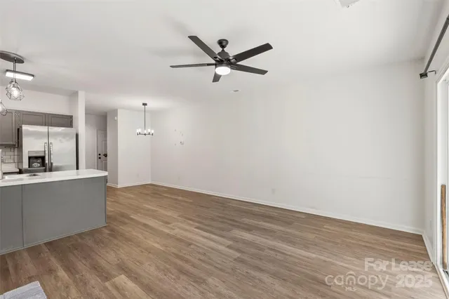a view of kitchen with wooden floor and window