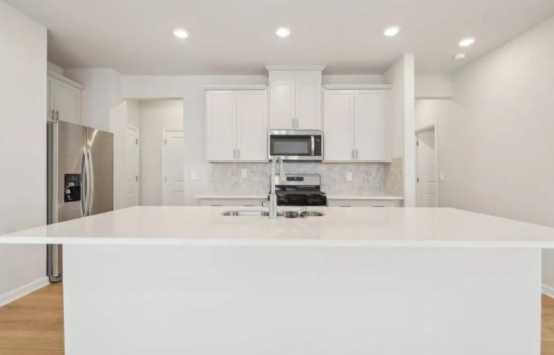 2850 Aralynn Way College Park, GA 30337 - Photo 3 of 9 a kitchen with stainless steel appliances a refrigerator sink and microwave