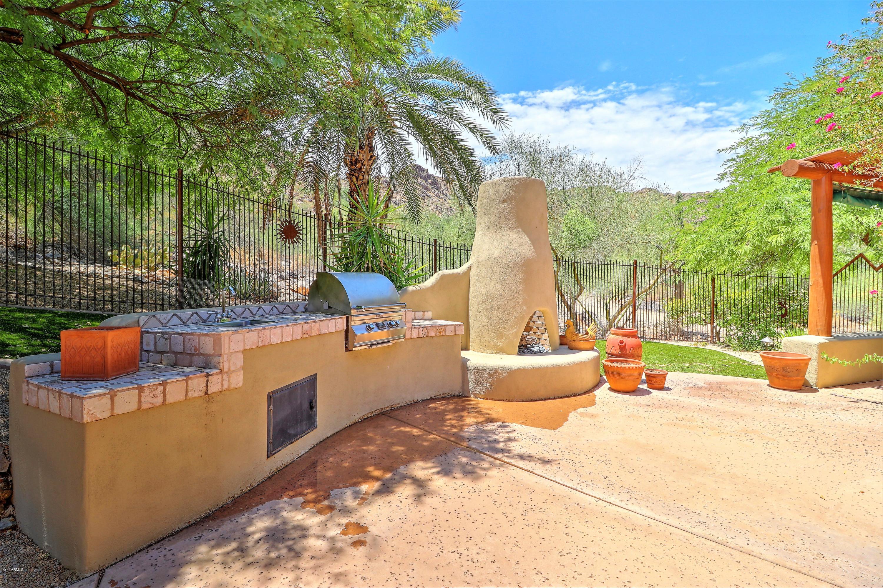 6107 East Quartz Mountain Road Paradise Valley, AZ 85253 - Photo 11 of 63 Back BBQ, sink and fireplace