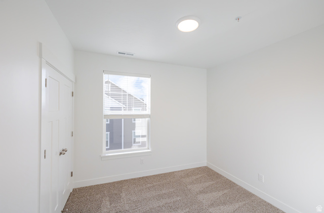 4662 Poplar Way, Unit Q301 Mapleton, UT 84664 - Photo 15 of 18 Spare room featuring baseboards and light carpet