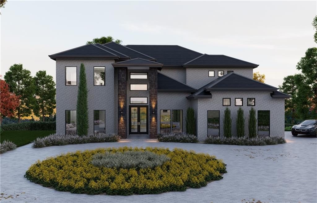 a view of a white house with a large windows and a yard with plants