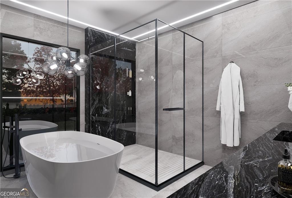 5016 Colton Run Atlanta, GA 30349 - Photo 19 of 31 a bathroom with a bathtub and a shower