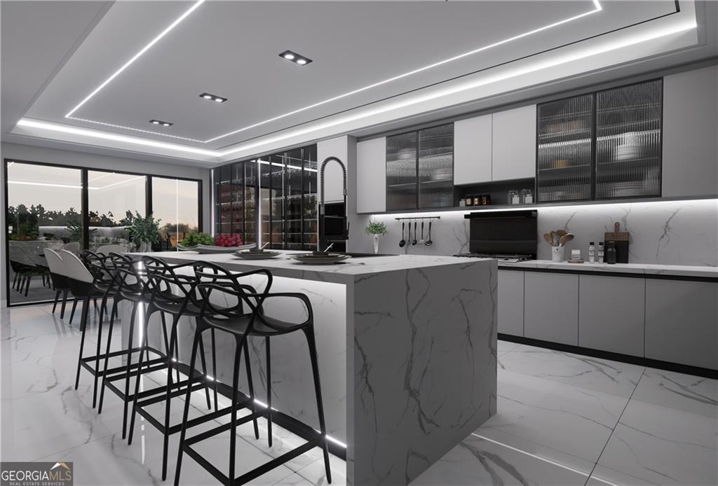 5016 Colton Run Atlanta, GA 30349 - Photo 8 of 31 a kitchen with stainless steel appliances granite countertop table chairs sink and cabinets