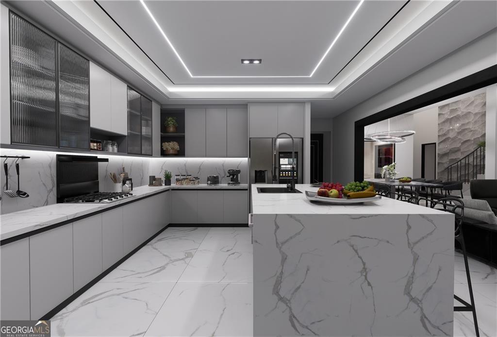 5016 Colton Run Atlanta, GA 30349 - Photo 10 of 31 a large kitchen with stainless steel appliances lots of counter top space