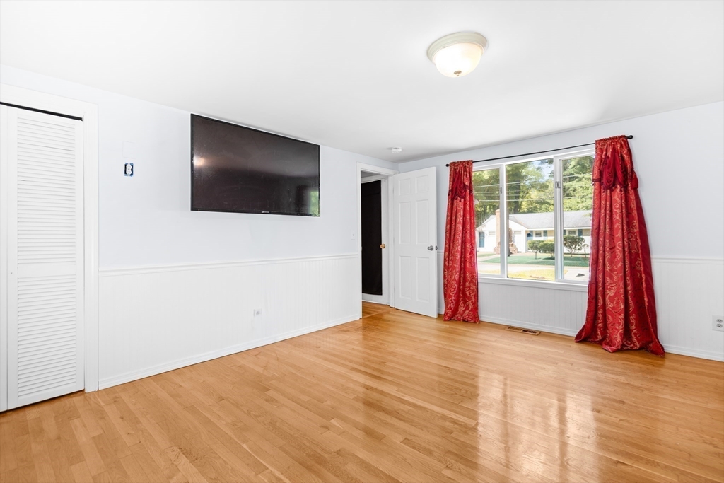 27 Ward Well Road Canton, MA 02021 - Photo 12 of 33 a view of a livingroom with wooden floor and a flat screen tv