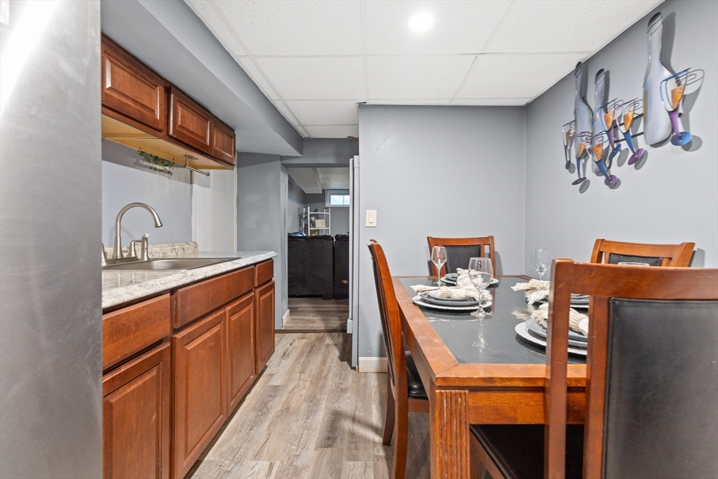 27 Ward Well Road Canton, MA 02021 - Photo 18 of 33 a kitchen with stainless steel appliances a table and chairs