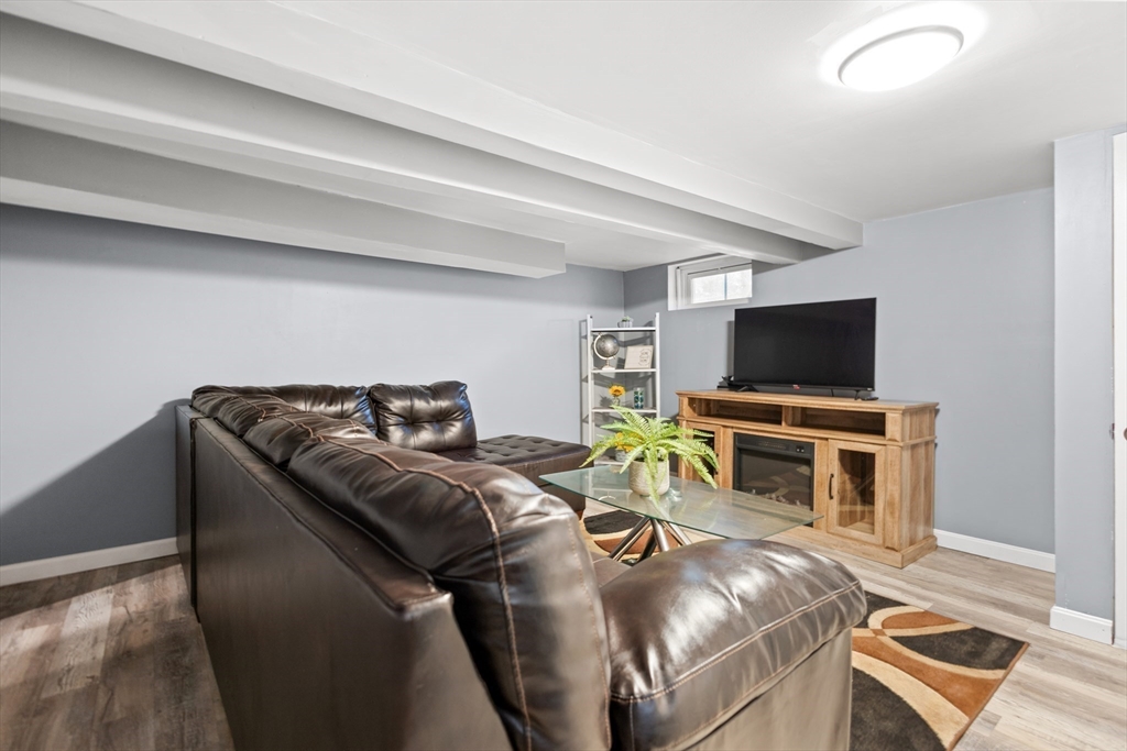 27 Ward Well Road Canton, MA 02021 - Photo 19 of 33 a living room with furniture and a flat screen tv