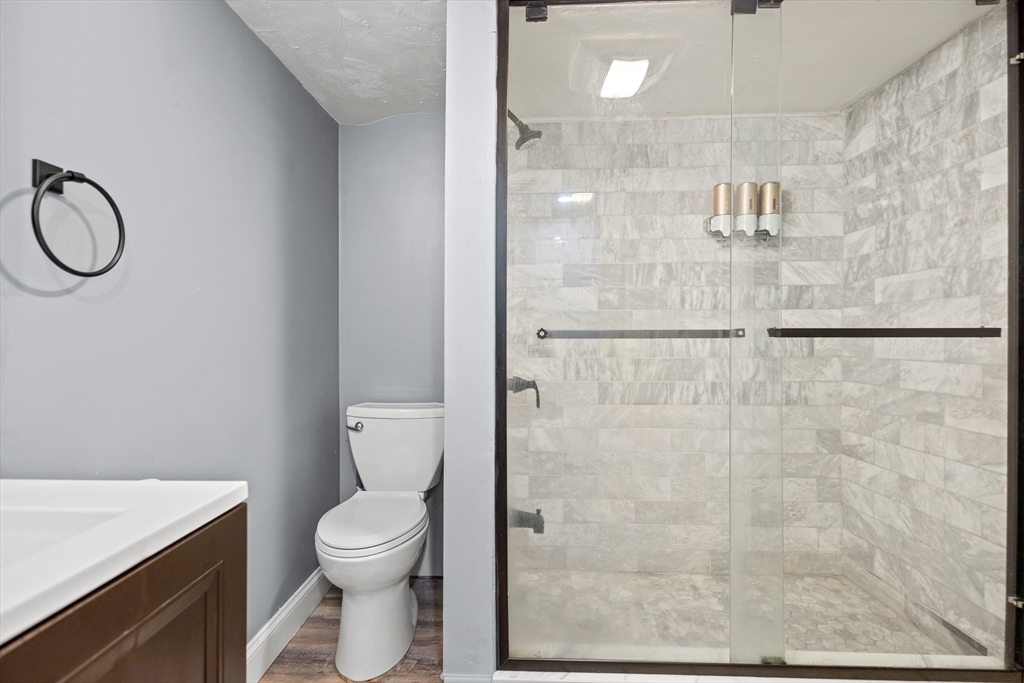 27 Ward Well Road Canton, MA 02021 - Photo 21 of 33 a bathroom with a toilet a sink and shower