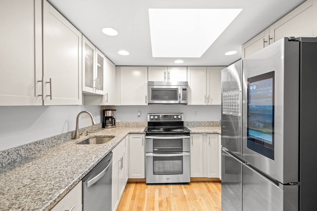 27 Ward Well Road Canton, MA 02021 - Photo 5 of 33 a kitchen with stainless steel appliances granite countertop a sink stove and refrigerator
