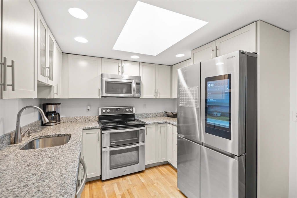 27 Ward Well Road Canton, MA 02021 - Photo 6 of 33 a kitchen with stainless steel appliances granite countertop a refrigerator sink and stove