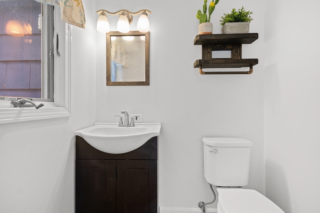 27 Ward Well Road Canton, MA 02021 - Photo 9 of 33 a bathroom with a sink toilet and mirror