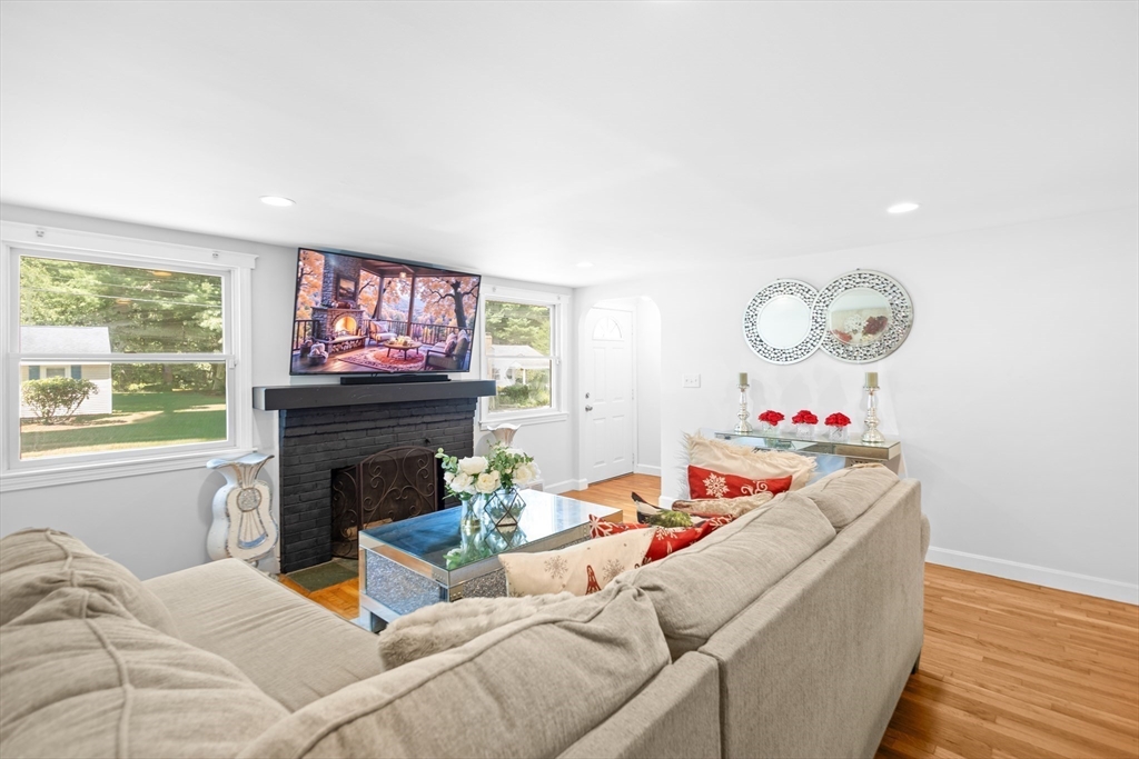 27 Ward Well Road Canton, MA 02021 - Photo 10 of 33 a living room with furniture and a fireplace