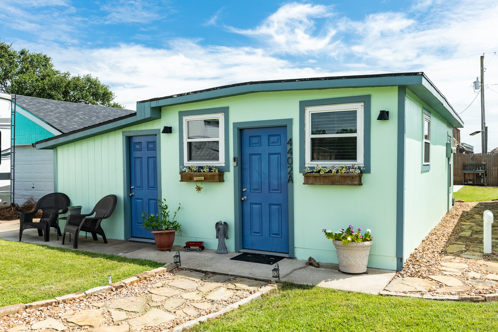 4402 Zelsky Road Freeport, TX 77541 - Photo 10 of 37 a front view of a house with garden