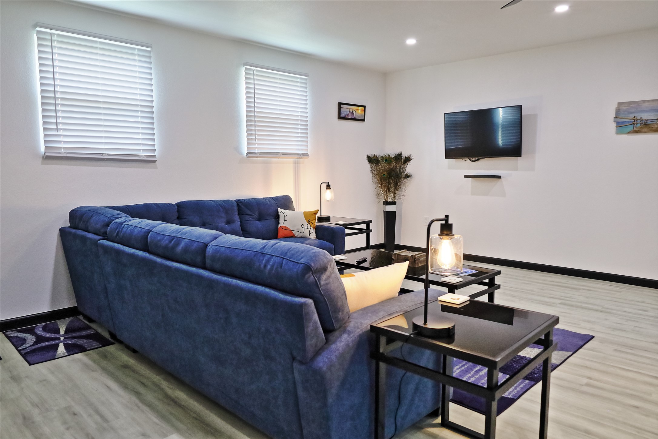 4402 Zelsky Road Freeport, TX 77541 - Photo 36 of 37 a living room with furniture a flat screen tv and a window