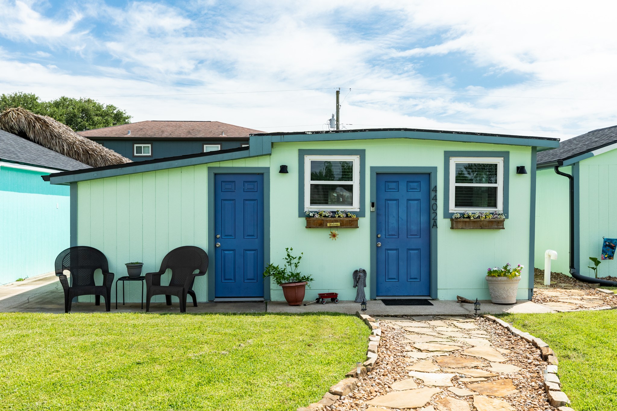 4402 Zelsky Road Freeport, TX 77541 - Photo 2 of 37 a front view of a house with garden