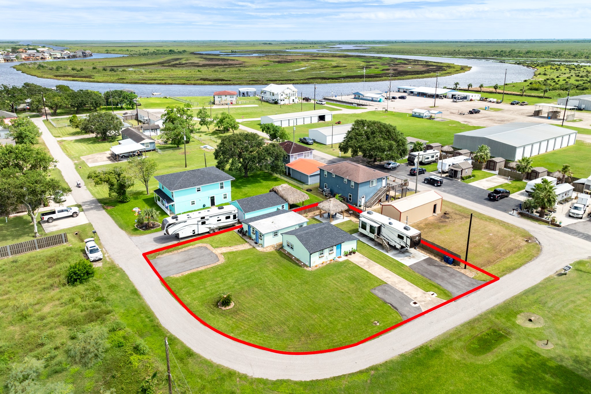 4402 Zelsky Road Freeport, TX 77541 - Photo 30 of 37 an aerial view of a swimming pool and lake view