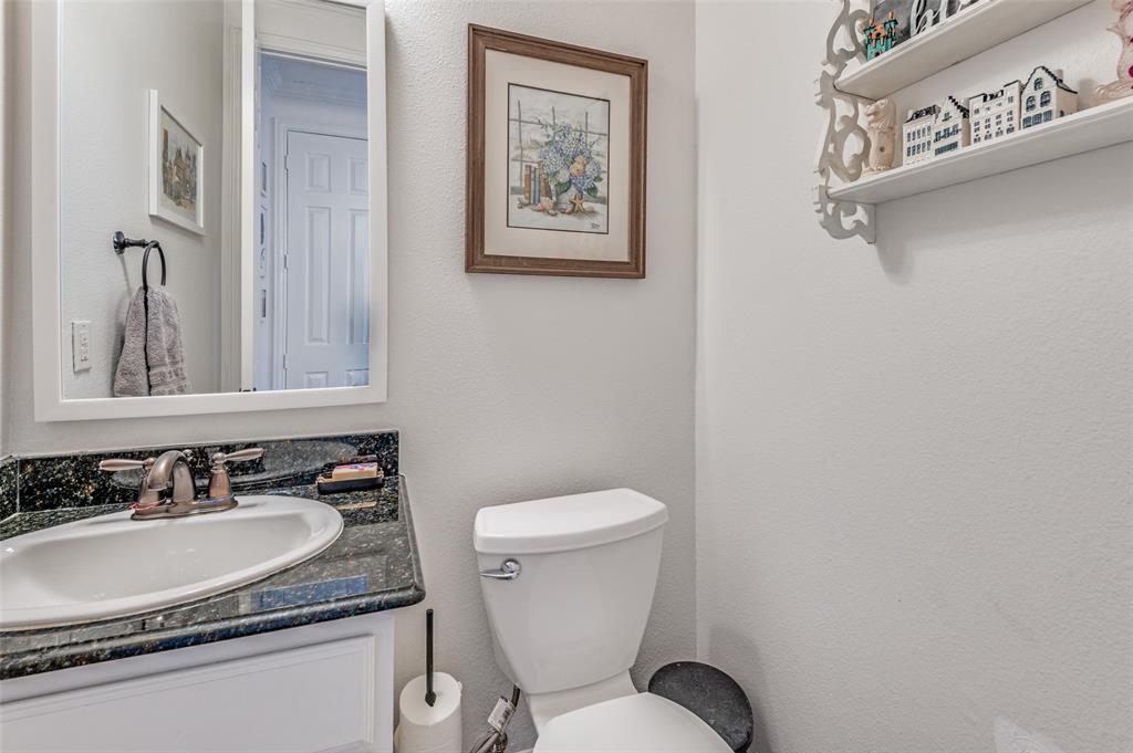 2505 Corbeau Drive Irving, TX 75038 - Photo 15 of 25 Half bathroom conveniently located on first floor.