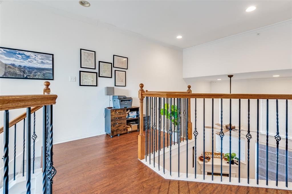 2505 Corbeau Drive Irving, TX 75038 - Photo 16 of 25 Designer wrought iron balusters create a special landing space at the top of the stairs.