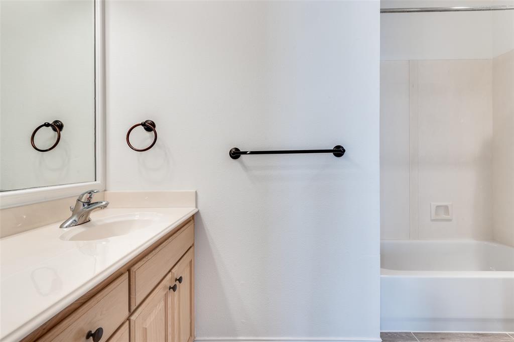 2505 Corbeau Drive Irving, TX 75038 - Photo 19 of 25 Ensuite bathroom with tub.