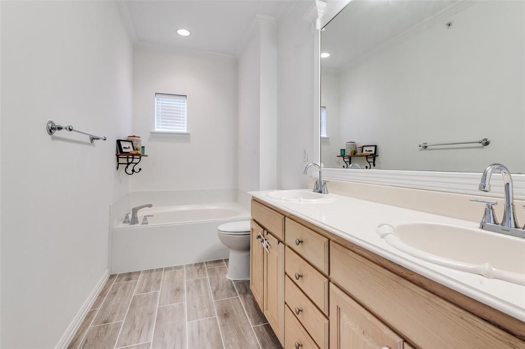 2505 Corbeau Drive Irving, TX 75038 - Photo 21 of 25 Beautiful, neutral with double sinks and soaking tub.