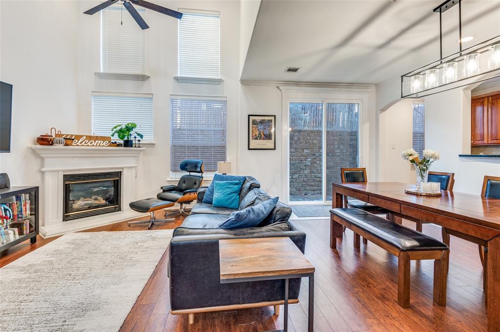 2505 Corbeau Drive Irving, TX 75038 - Photo 4 of 25 Soaring ceiling, cozy fireplace and walls of windows.