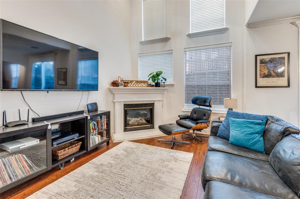2505 Corbeau Drive Irving, TX 75038 - Photo 5 of 25 This home's focal point is the fireplace that adds warmth and charm to this gorgeous space.