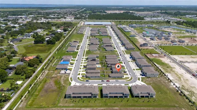 aerial view of a residential apartment building with a street sign and a large mirror
