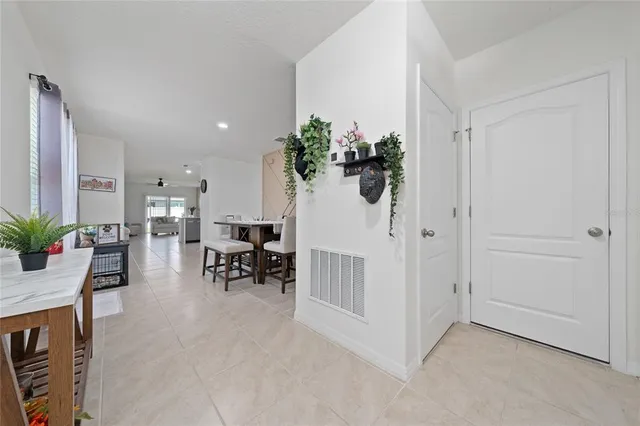 a view of a livingroom with furniture and a potted plant