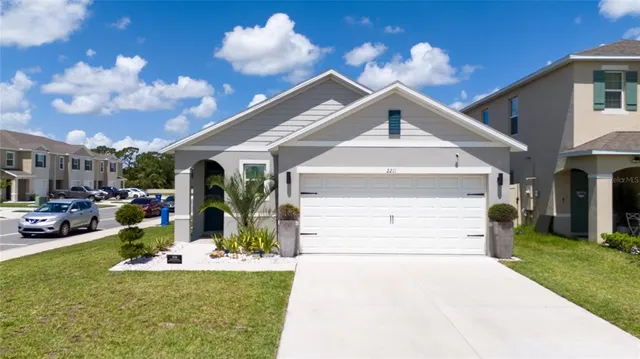 a view of a house with a sink and a yard