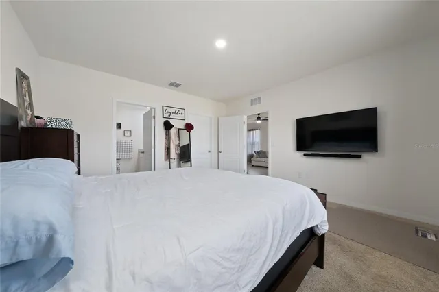 a white toilet sitting next to a bathroom sink
