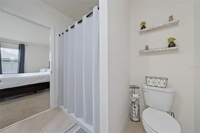 a view of a backyard with a garden and a chair