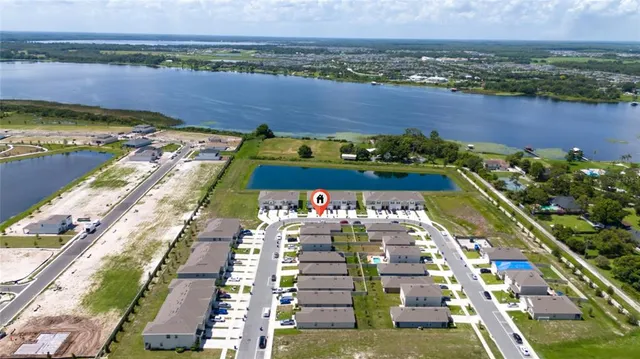an aerial view of a house a yard swimming pool and outdoor space