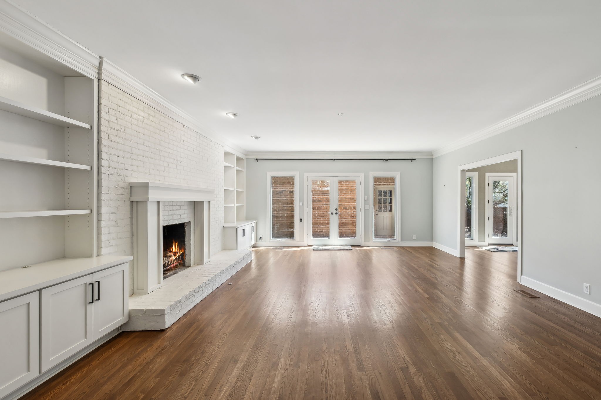 29 Washington Park Nashville, TN 37205 - Photo 18 of 60 a view of an empty room with wooden floor fireplace and a window
