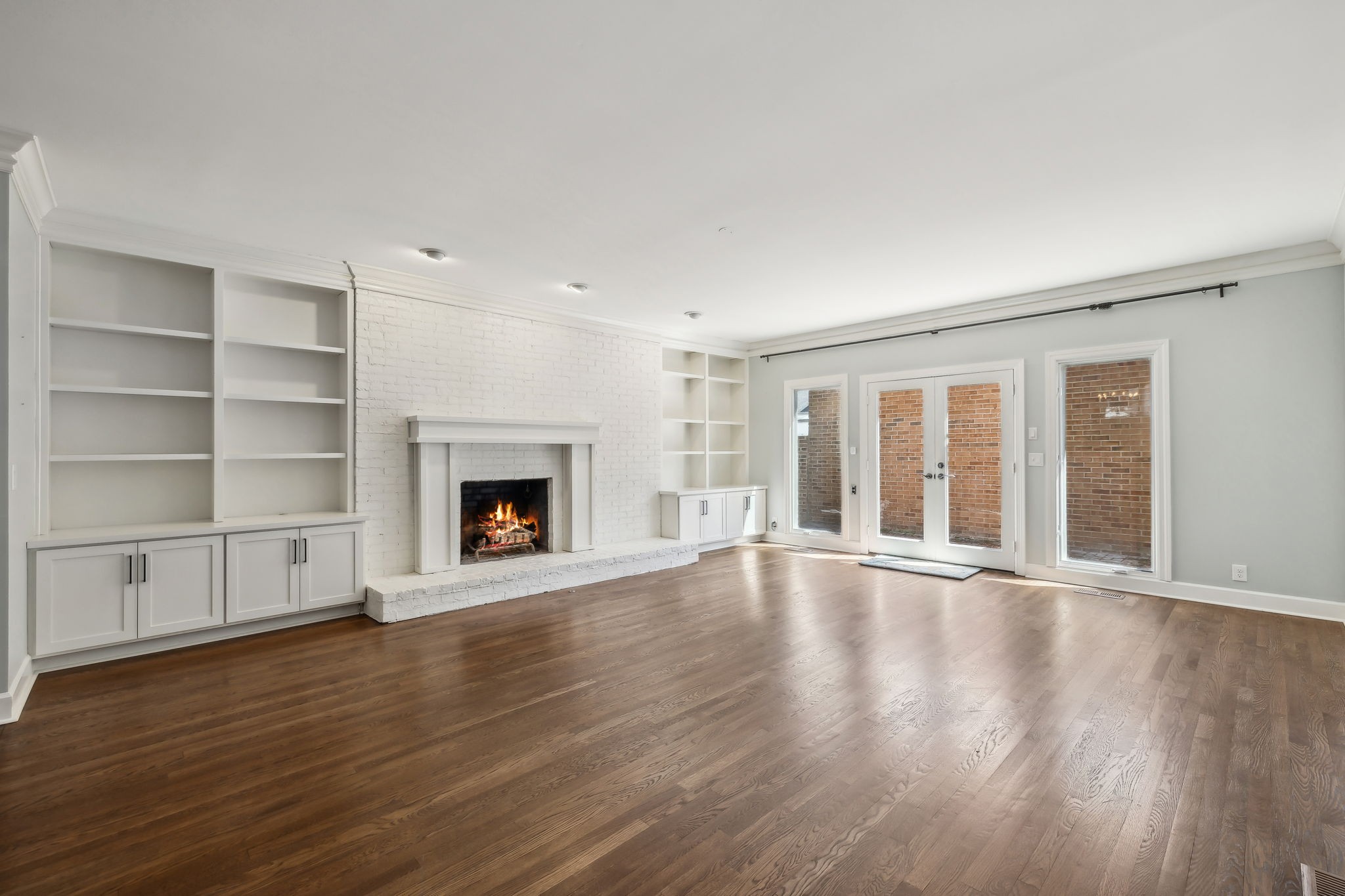 29 Washington Park Nashville, TN 37205 - Photo 19 of 60 a view of an empty room with wooden floor fireplace and a window