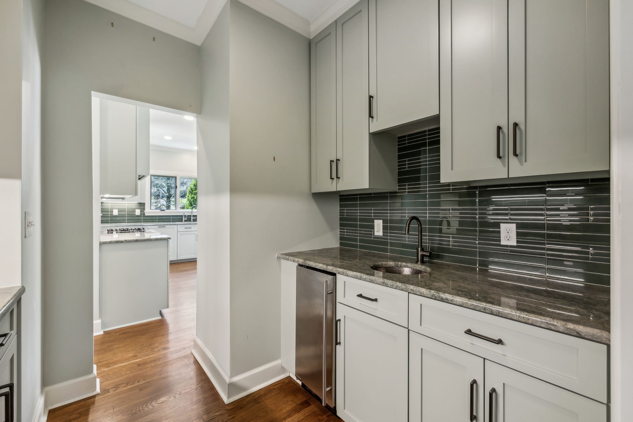 29 Washington Park Nashville, TN 37205 - Photo 20 of 60 a kitchen with stainless steel appliances granite countertop a sink a stove and a refrigerator