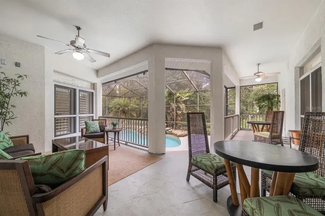 a view of a porch with furniture and a window