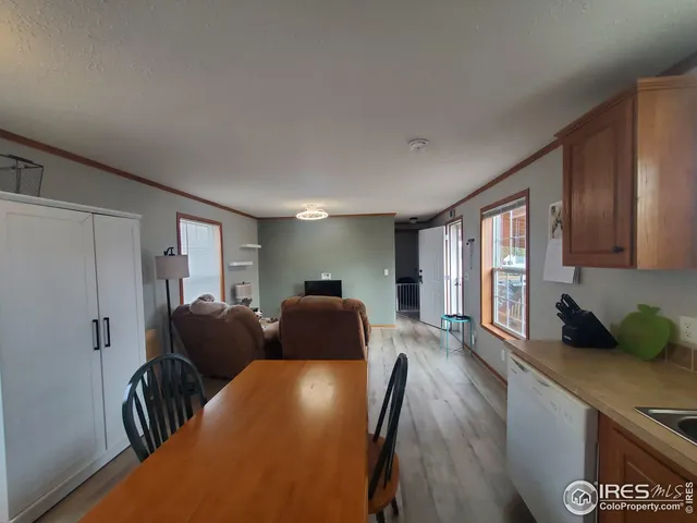 a view of a livingroom with furniture and wooden floor