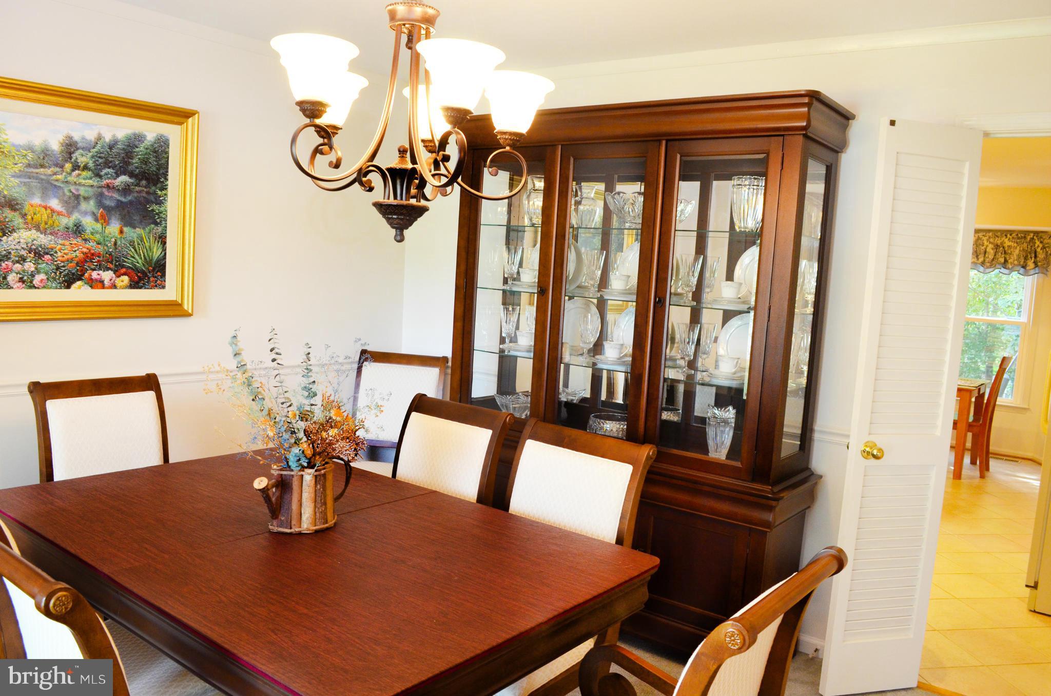 9200 Rockefeller Lane Springfield, VA 22153 - Photo 8 of 30 a view of a dining room with furniture and a window
